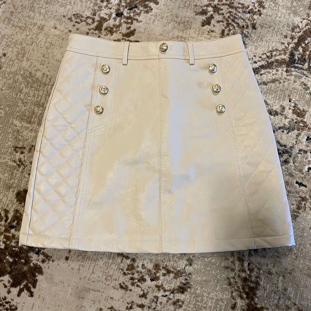 Leather look A-line mini skirt with gold buttons